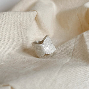 Handcrafted with real sage leaves, our Pure Silver 999 ring is a stunning piece of jewelry. Made with 100% pure silver, it boasts a timeless elegance and unique organic design. Elevate your style and connect with nature with this beautiful and expertly crafted ring.